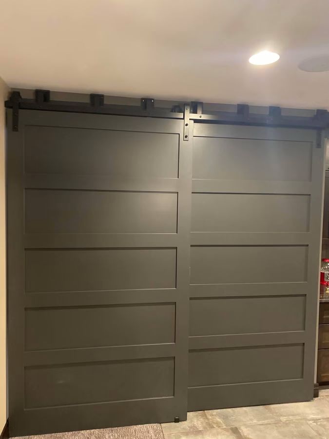 Double sliding barn doors closing off a finished living space