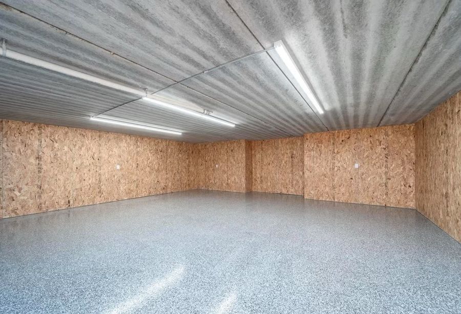 Garage with epoxy flake floor coating and finished walls