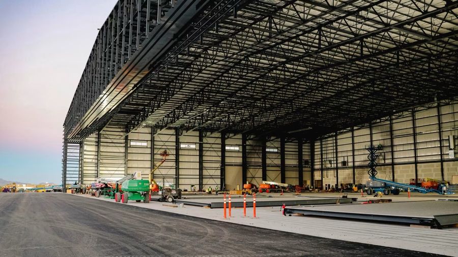 Large clear-span warehouse interior with the finished concrete slab poured